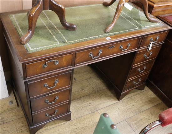 A Georgian style mahogany twin pedestal desk, W.122cm